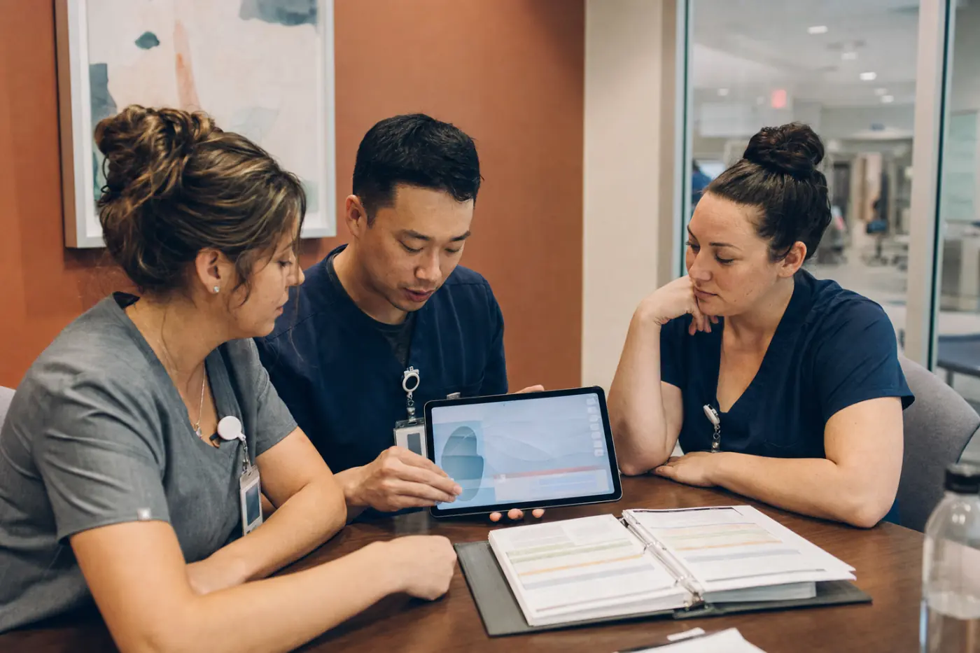 Healthcare professionals learning together with digital resources